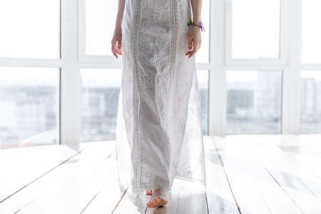 Girl with artificial butterfly on a handの写真素材