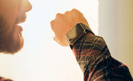 Closeup view of man using smart watch.の写真素材