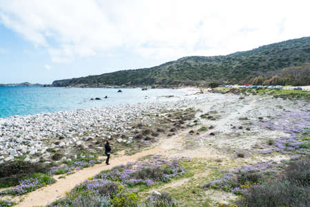 walking through flowery fieldの写真素材