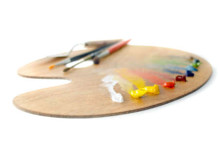 A palette with carnival paint and brushes, shallow depth of fieldの写真素材