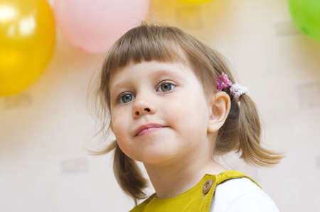 Portrait of a girl on the background of balloonsの写真素材