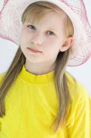 Portrait of a girl 8 years in a hat
