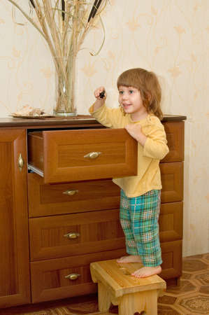 The girl opened the drawerの写真素材