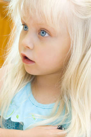 Portrait of the surprised little girl with a fair hairの写真素材
