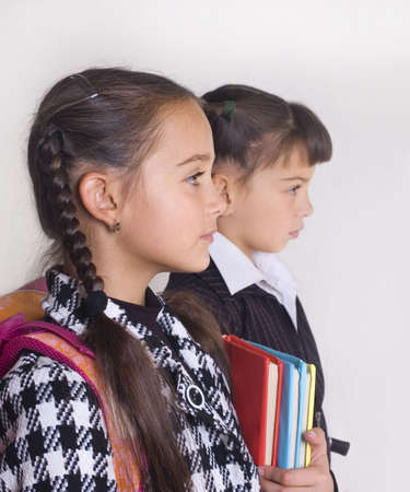 Portrait of two schoolgirls in a profileの写真素材