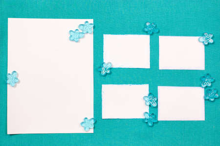 Sheets of paper on the blue drapery with glass beadsの写真素材