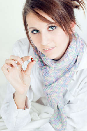 The girl holds a tablet in a handの写真素材