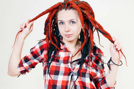 Girl with dreadlocks in his shirtの写真素材