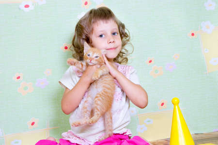 Girl hugging a favorite catの写真素材