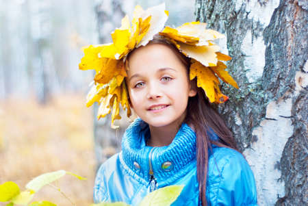 Girl in the autumn forestの写真素材
