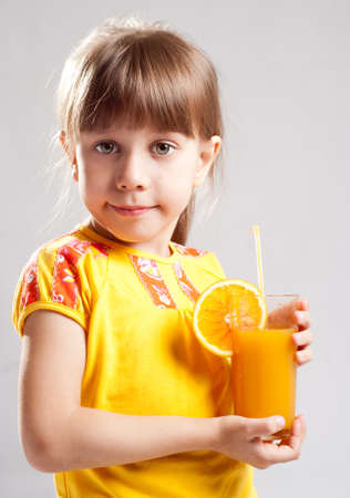 A girl with a glass of juiceの写真素材