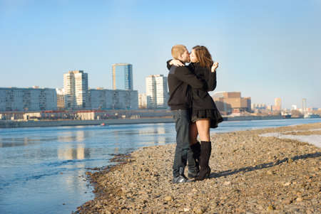 Young couple kissing on the Riverの写真素材