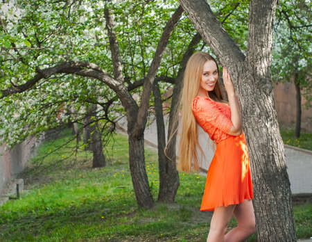 The girl in the lush spring gardenの写真素材