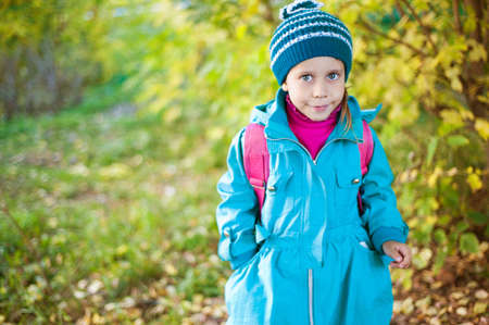 Girl walking in autumn forestの写真素材