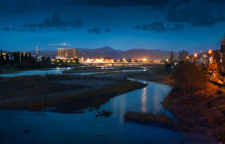 Night lights of the city and riverの写真素材