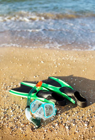 flippers and a mask at the seaの写真素材