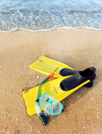flippers and a mask at the seaの写真素材