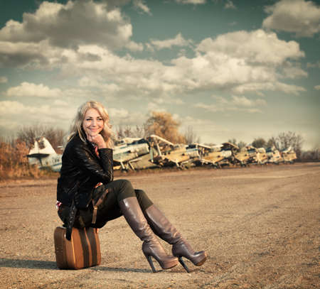 girl  sits at the planeの写真素材