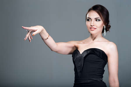 Woman showing a finger in the directionの写真素材