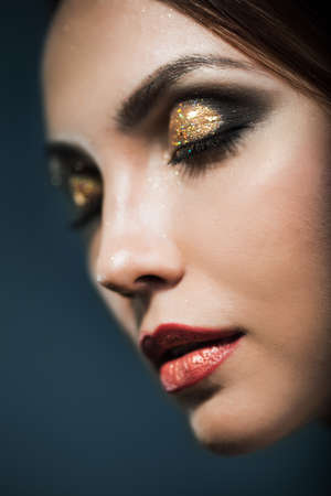 Portrait of a woman with bright makeup の写真素材
