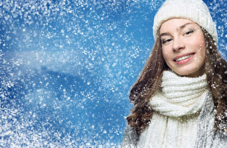 Face girl in winter hat snow