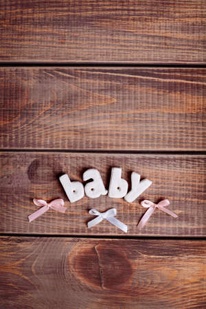 word baby in wood backgroundの写真素材