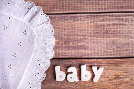 word baby in wood backgroundの写真素材
