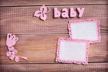 Napkins with pink lace on the wooden background の写真素材