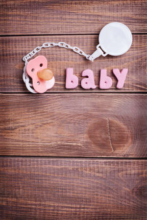 Napkins with pink lace on the wooden background の写真素材
