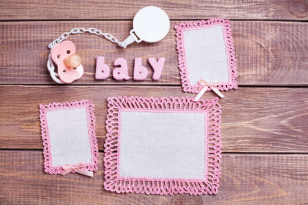 Napkins with pink lace on the wooden background の写真素材