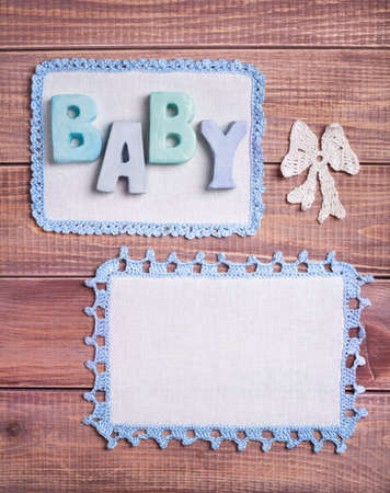 Napkins with blue lace on the wooden background の写真素材