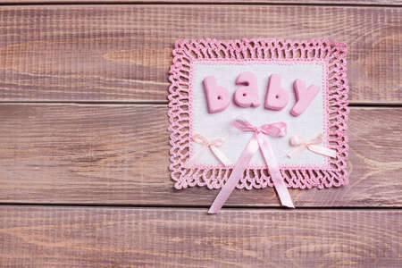 Napkin with pink lace on the wooden background の写真素材