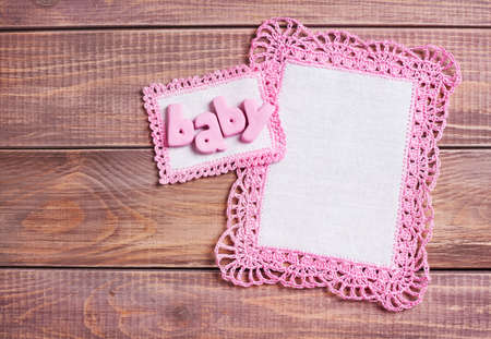 Napkins with pink lace on the wooden backgroundの写真素材
