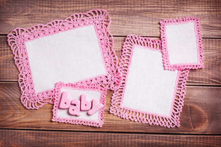 Napkins with pink lace on the wooden backgroundの写真素材