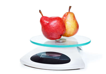 Kitchen weight scale with pears. Isolated on white background. の写真素材