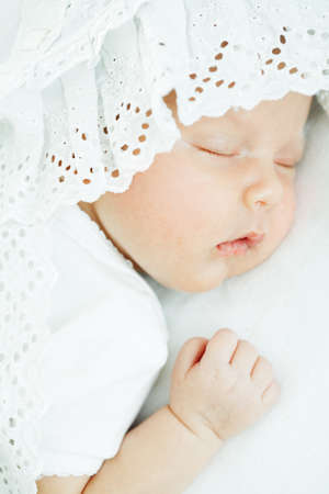 newborn baby one month age on white