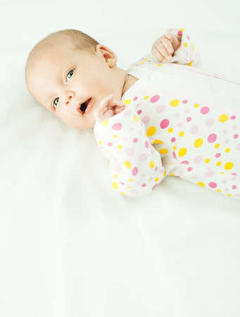 newborn baby one month age on white の写真素材