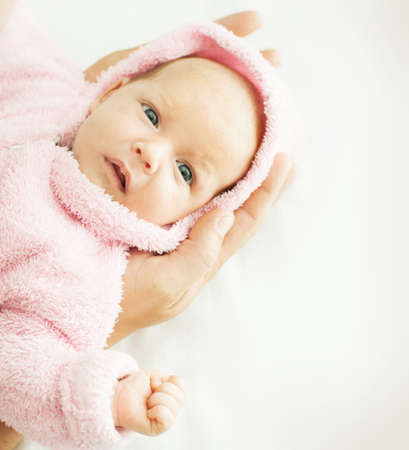 newborn baby one month age on white の写真素材