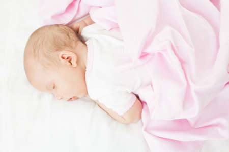 newborn baby one month age on white