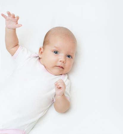 newborn baby one month age on white 