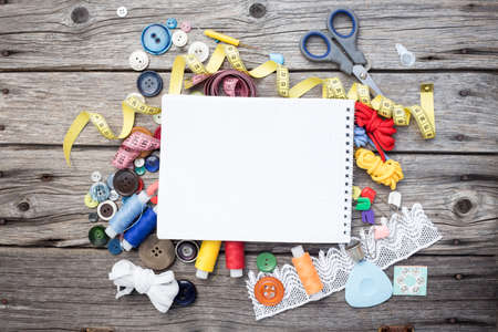 thread and sewing on wooden boards 