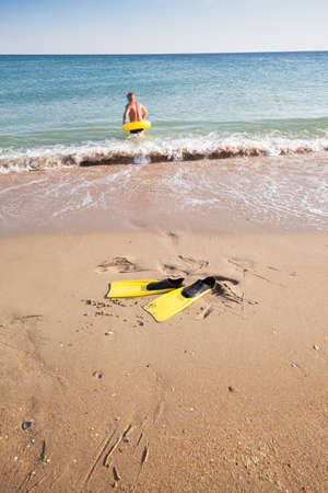 flippers  on the bank of the seaの写真素材
