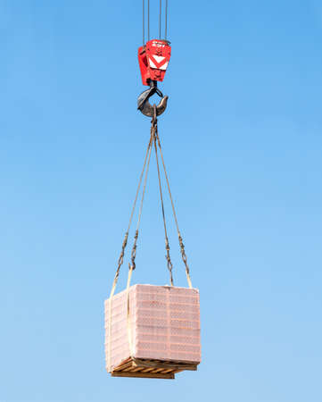 Hook cargo crane on the sky backgroundの写真素材