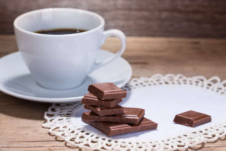 warm cup of coffee on wooden backgroundの写真素材