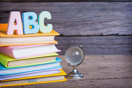 school supplies labeled ABC on a wooden backgroundの写真素材