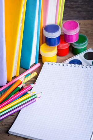 school supplies on a wooden backgroundの写真素材