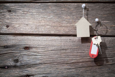 paper and keys on wooden background の写真素材
