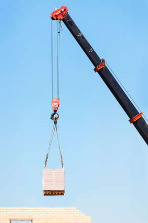 Hook cargo crane on the sky backgroundの写真素材