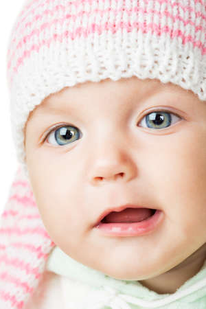 cheerful baby six months old, white background