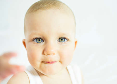 infant age ten months on a white backgroundの写真素材
